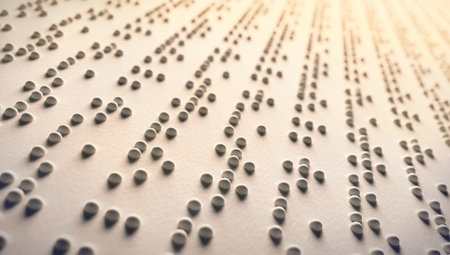 A close up view of a page of braille
