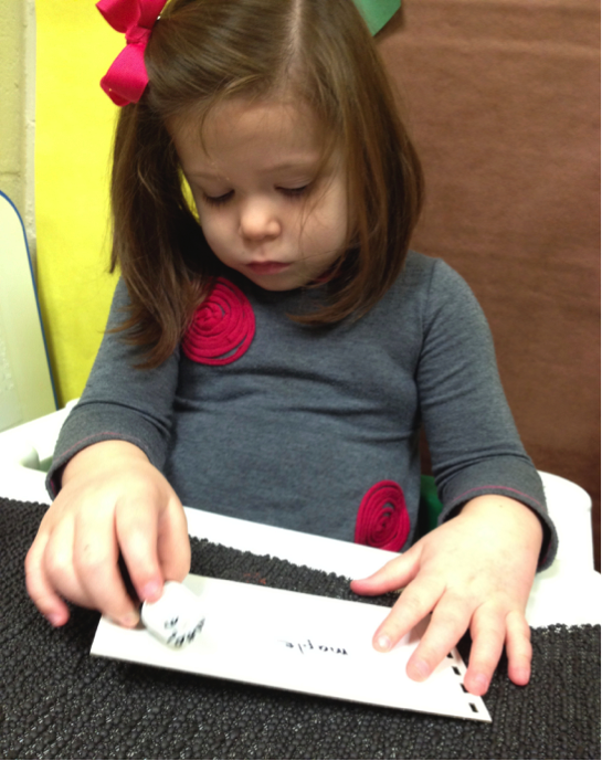 Alison with braille materials