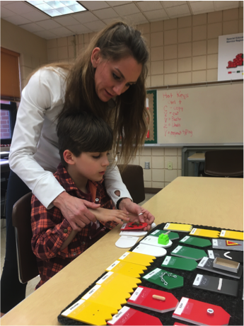 Student examining tactile symbols