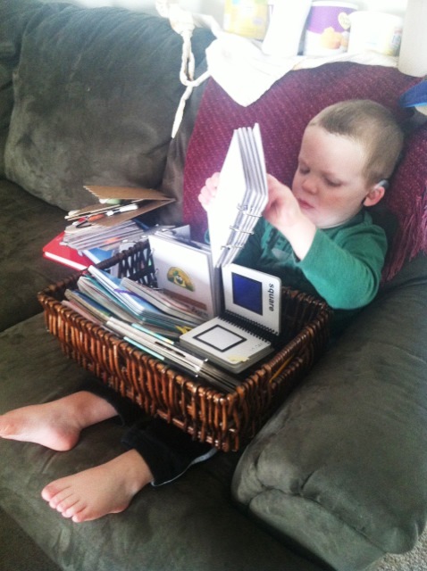 A toddler exploring tactile books