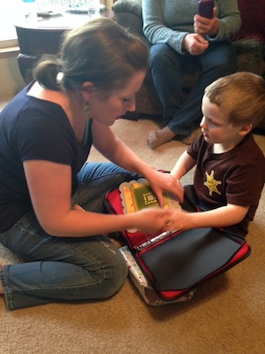 Mother and son looking at tactile book together