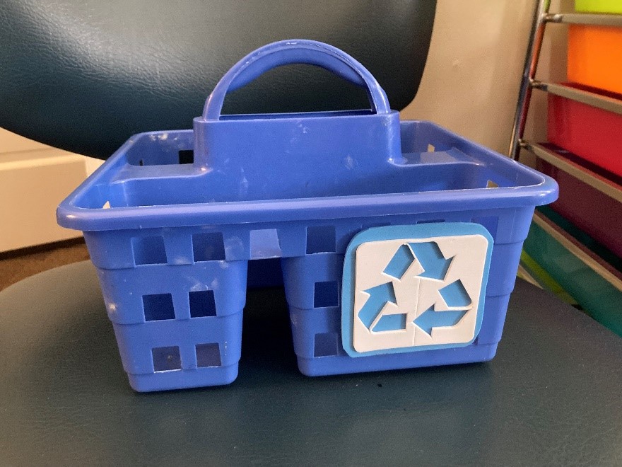 A plastic bin that has the recycling symbol on it made from adhesive craft foam