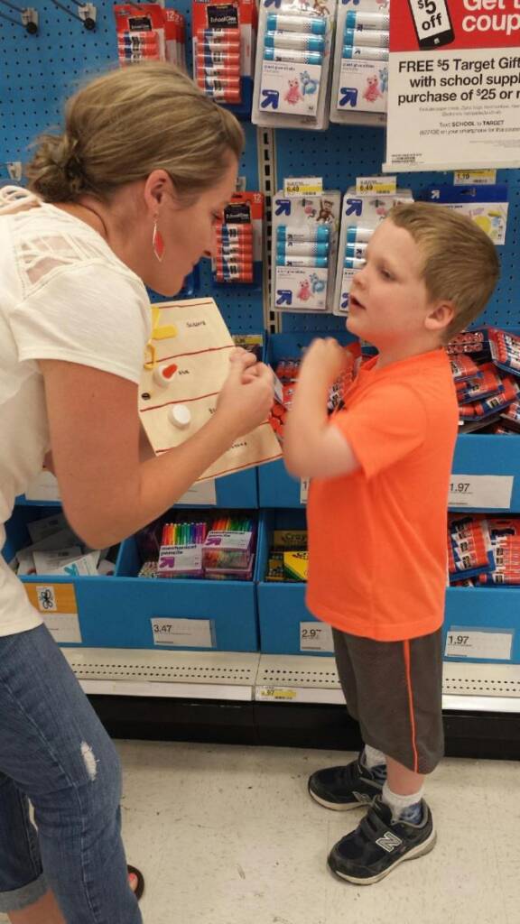 Liam signs to his mother about the items on the list.