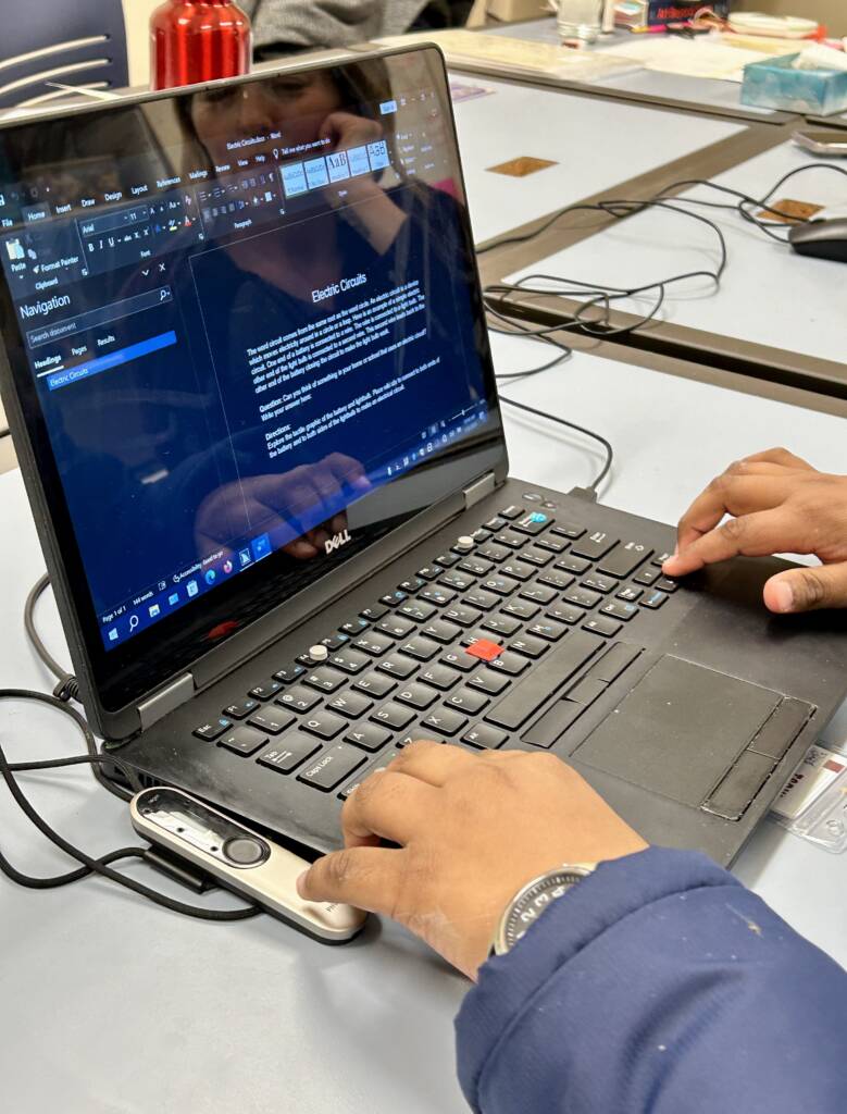 A student using a laptop