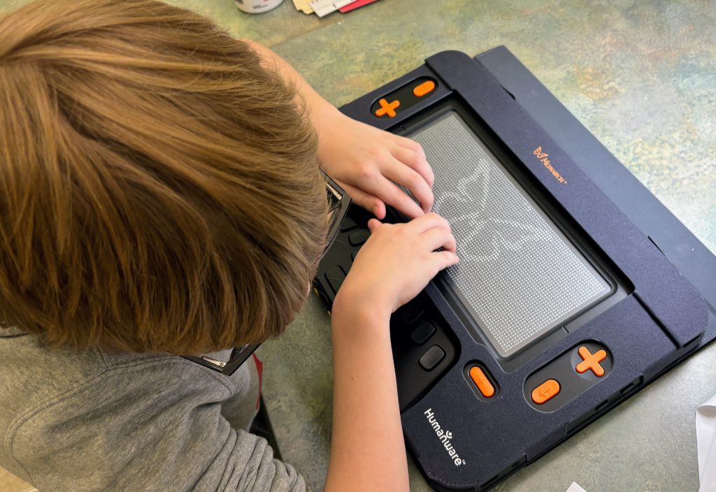 A student using the Monarch device