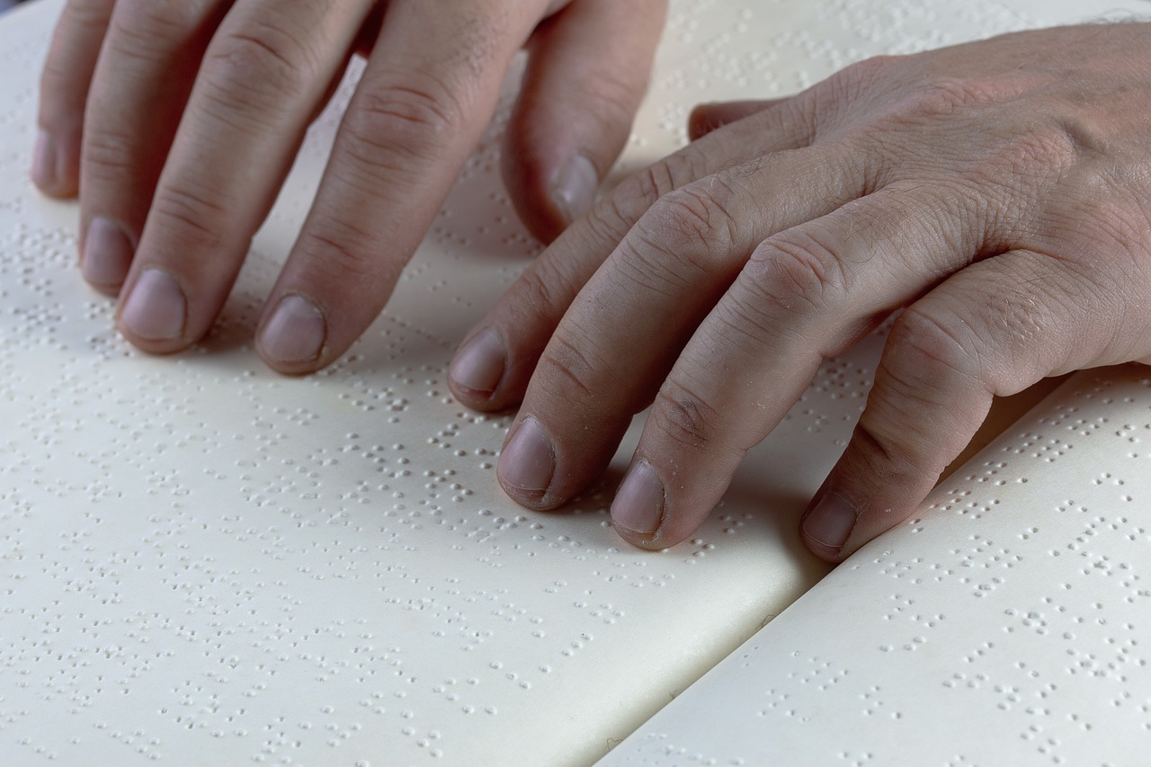 Hands reading braille