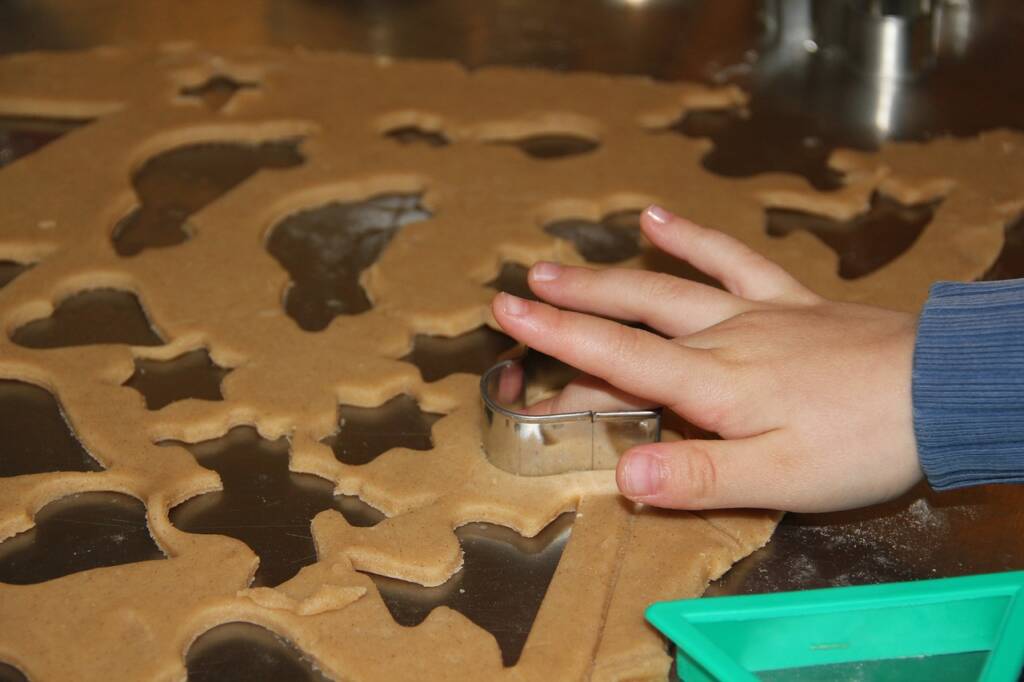 A child using a cookie cutter