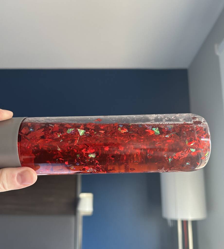 Red glitter liquid in a bottle
