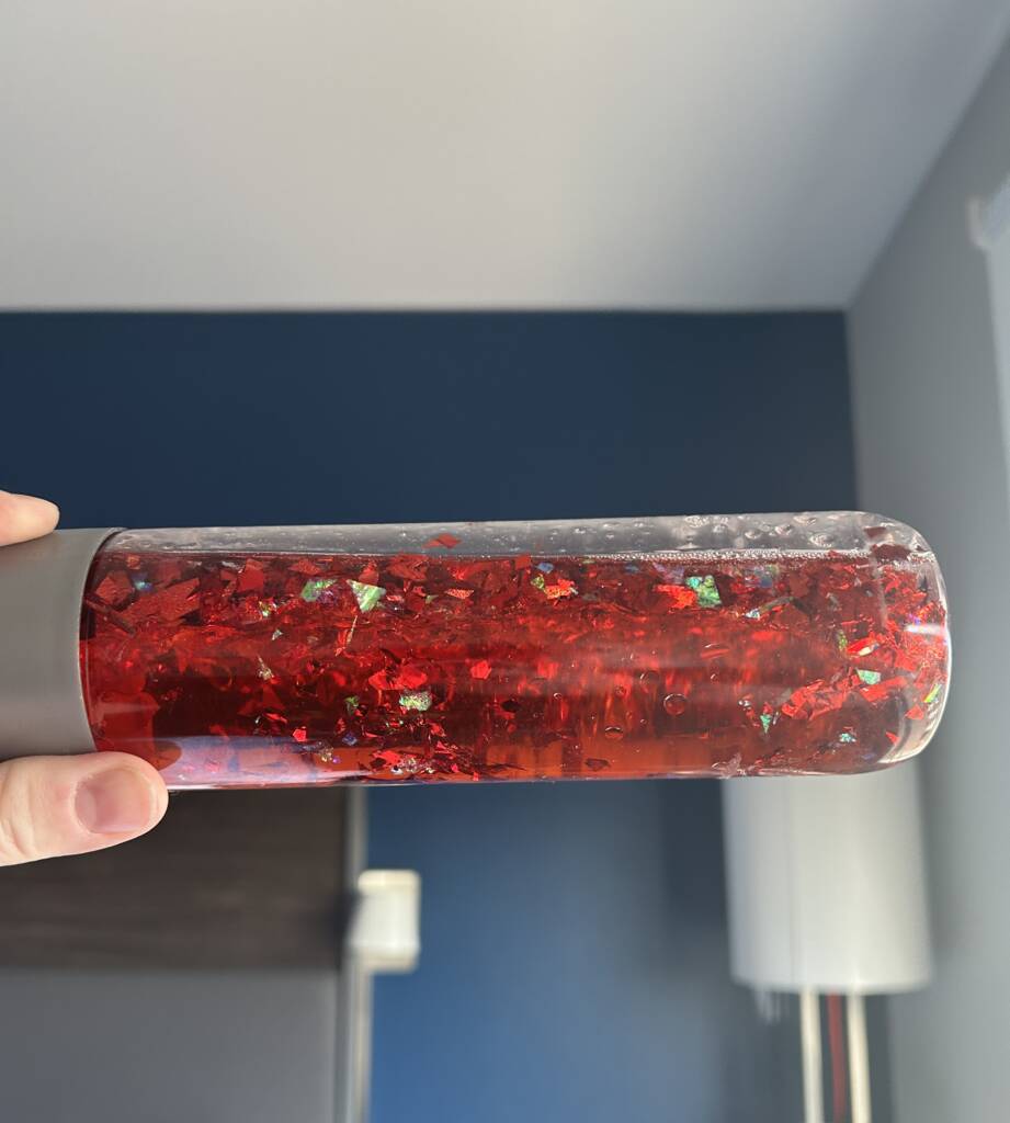 Red glitter liquid in a bottle