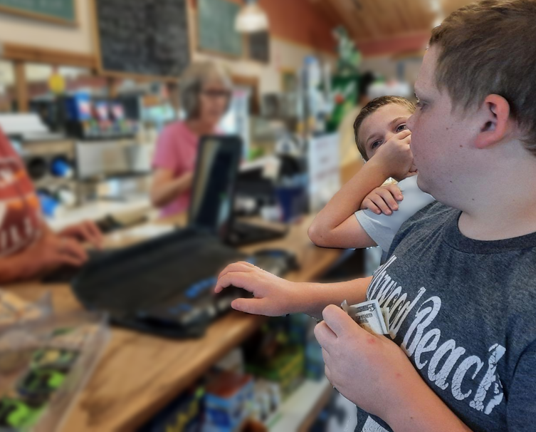 Liam and his brother at a cafe counter ordering