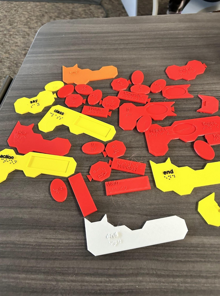 Here are the tactile blocks that were created with a 3D printer that represent the commands in the quorum language.