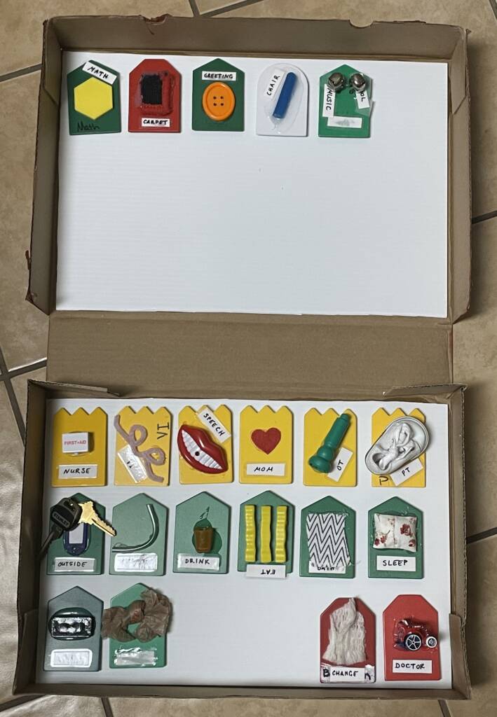 Inside of box with all the tactile cards. Top of the box has her school item cards.
The bottom three rows have other schedule cards.