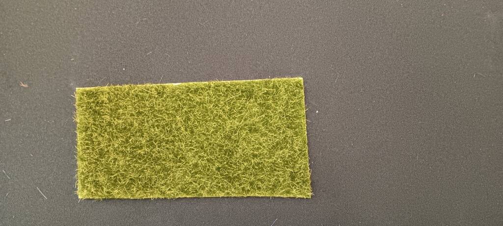 Plastic grass can be added to the book.