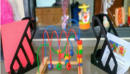 Table top with the bead maze activity. 