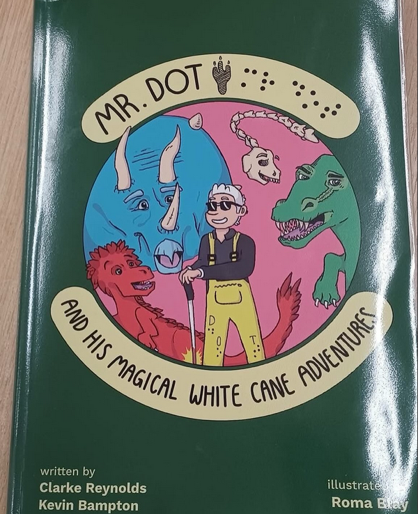 Mr. Dot and his magical white cane adventures- book cover with Mr. Dot and dinosaurs.