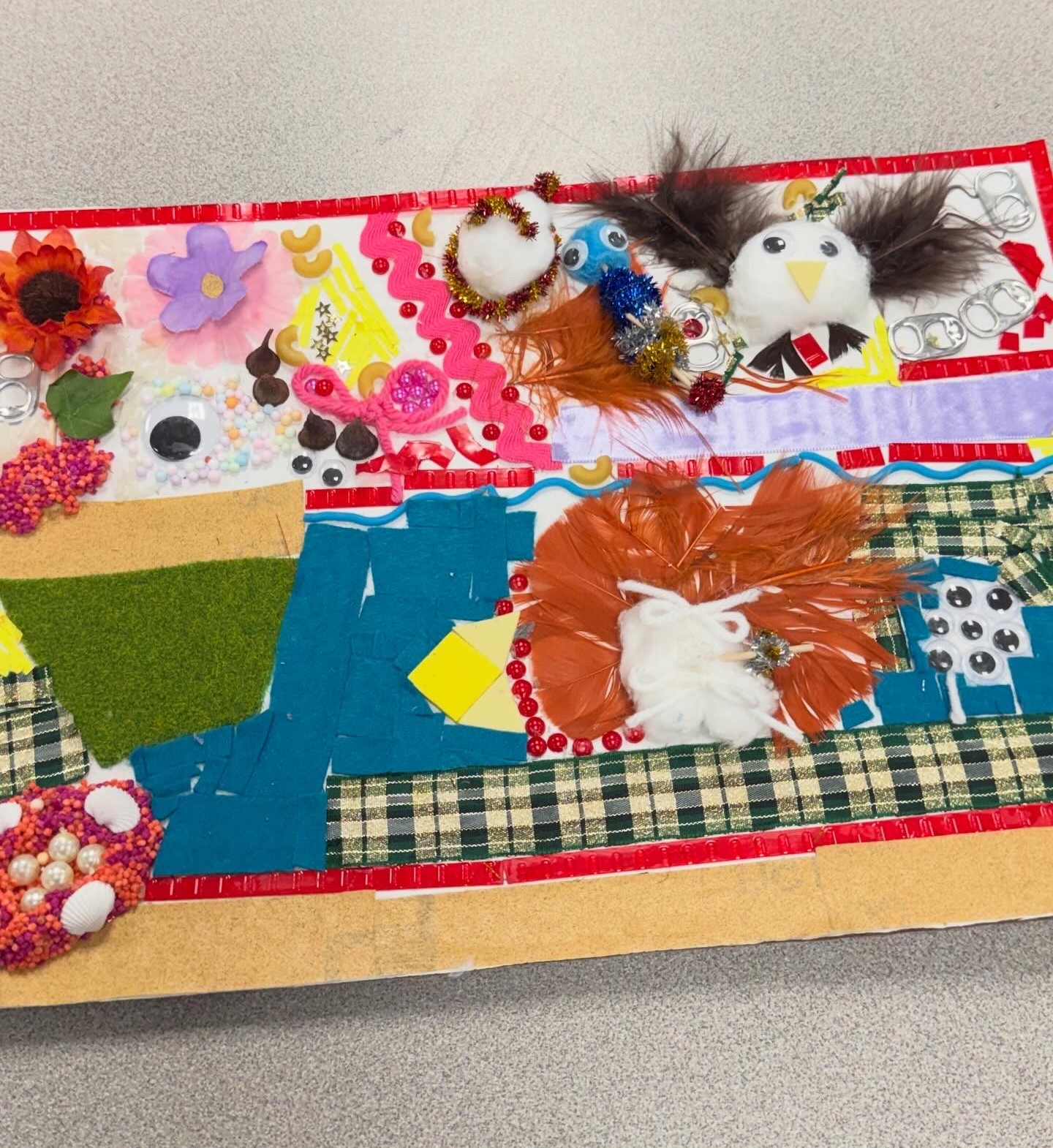 3 Project- Abstract tactile art using mostly fabric scraps, fake flowers, feathers and googly eyes