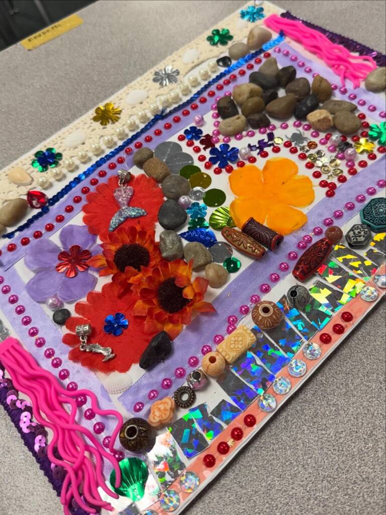 5 Project- Abstract tactile art using a lot of pink and purple with a lace and rock border.