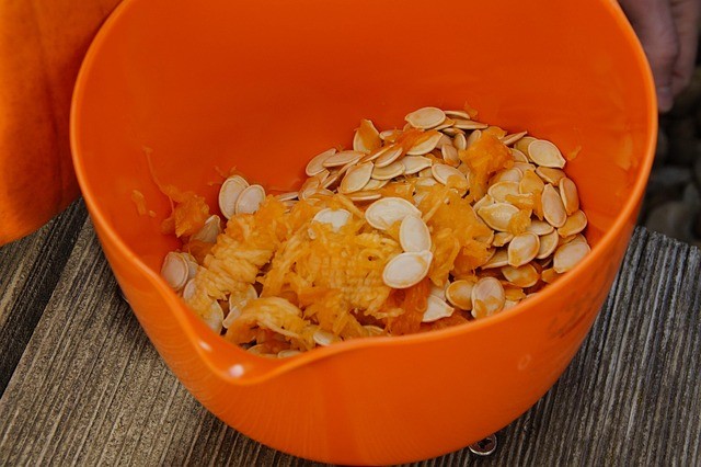 A bowl of pumpkin seeds.