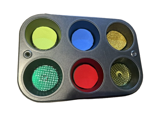 six hole muffin tin with different textures in each.