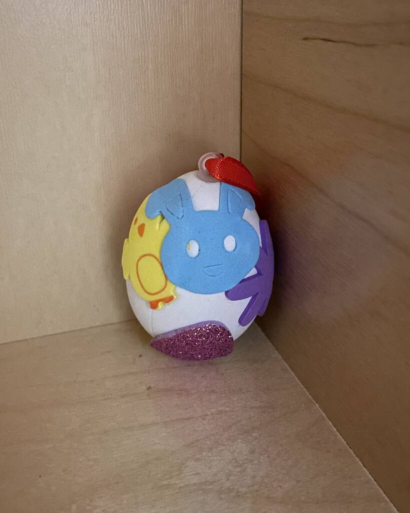 Finished egg with a variety of tactile stickers on the egg. 