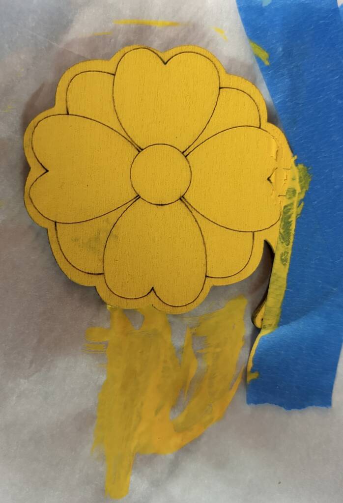 Painted yellow flower head. 