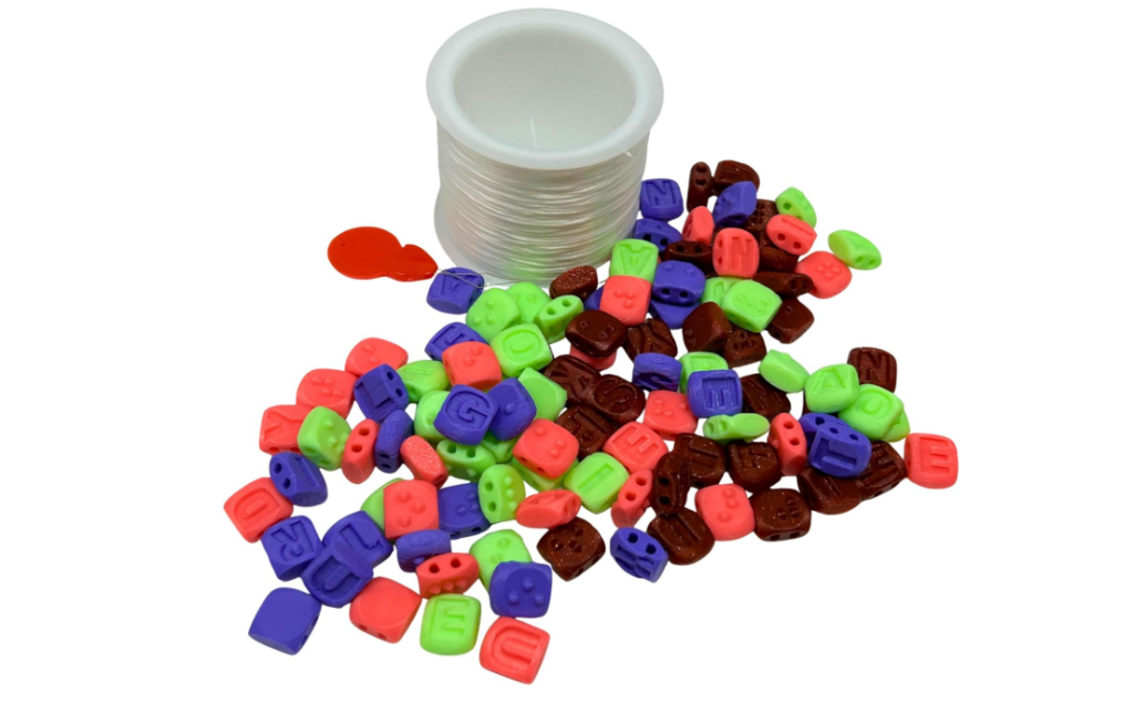 Plastic beads that have print and braille on them. 