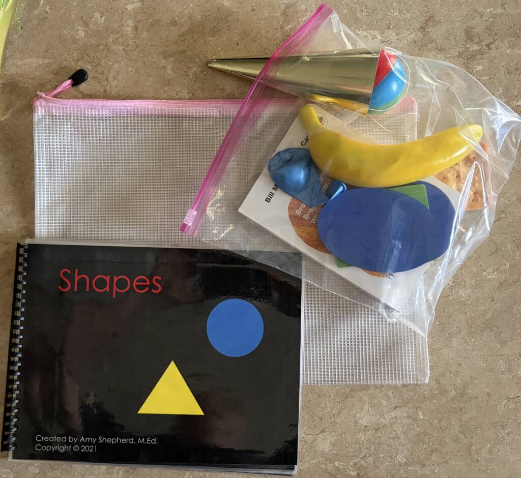 The CVI book nook Shapes book and a bag of objects to represent the shapes in the book.