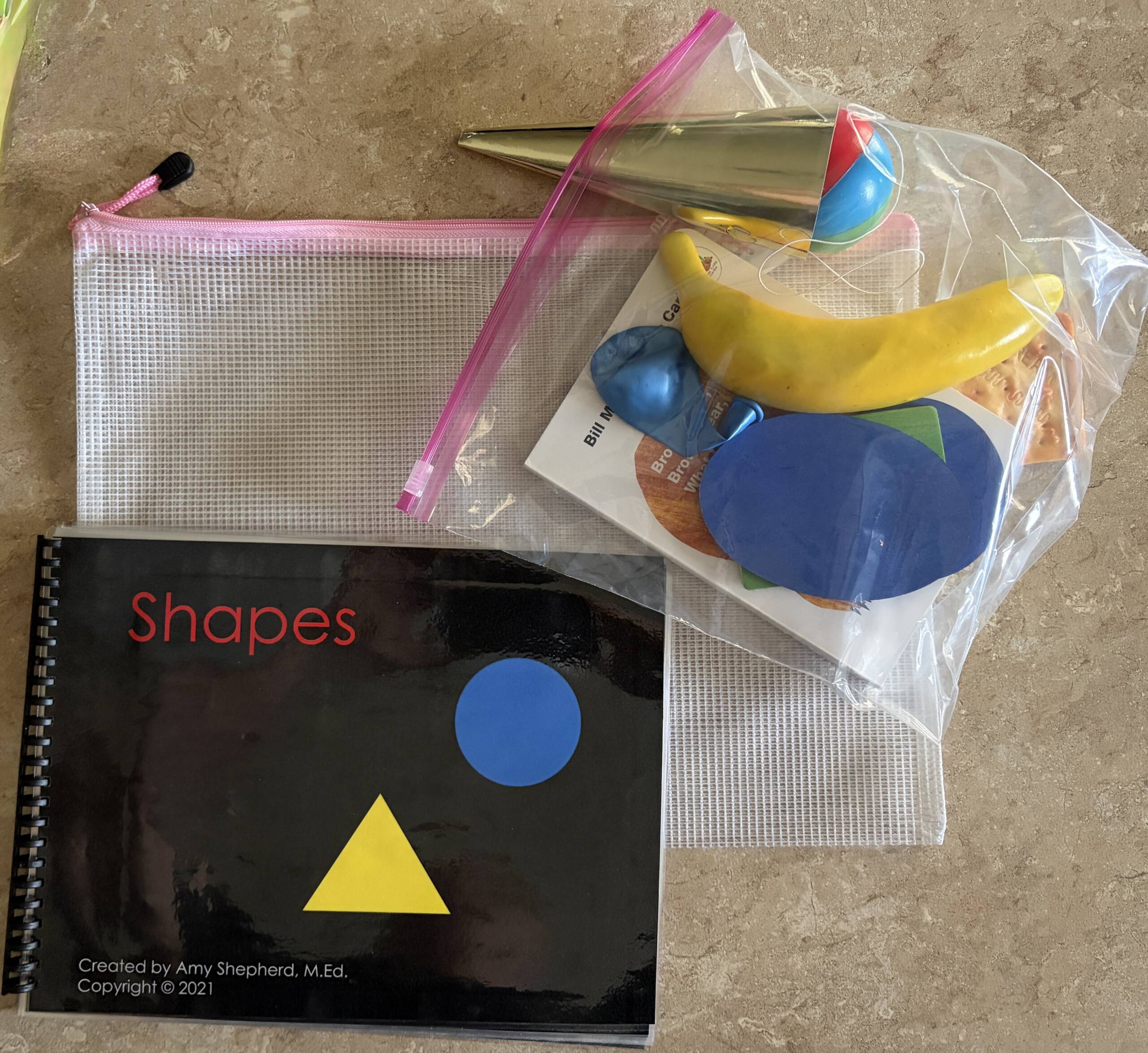 The CVI book nook Shapes book and a bag of objects to represent the shapes in the book.