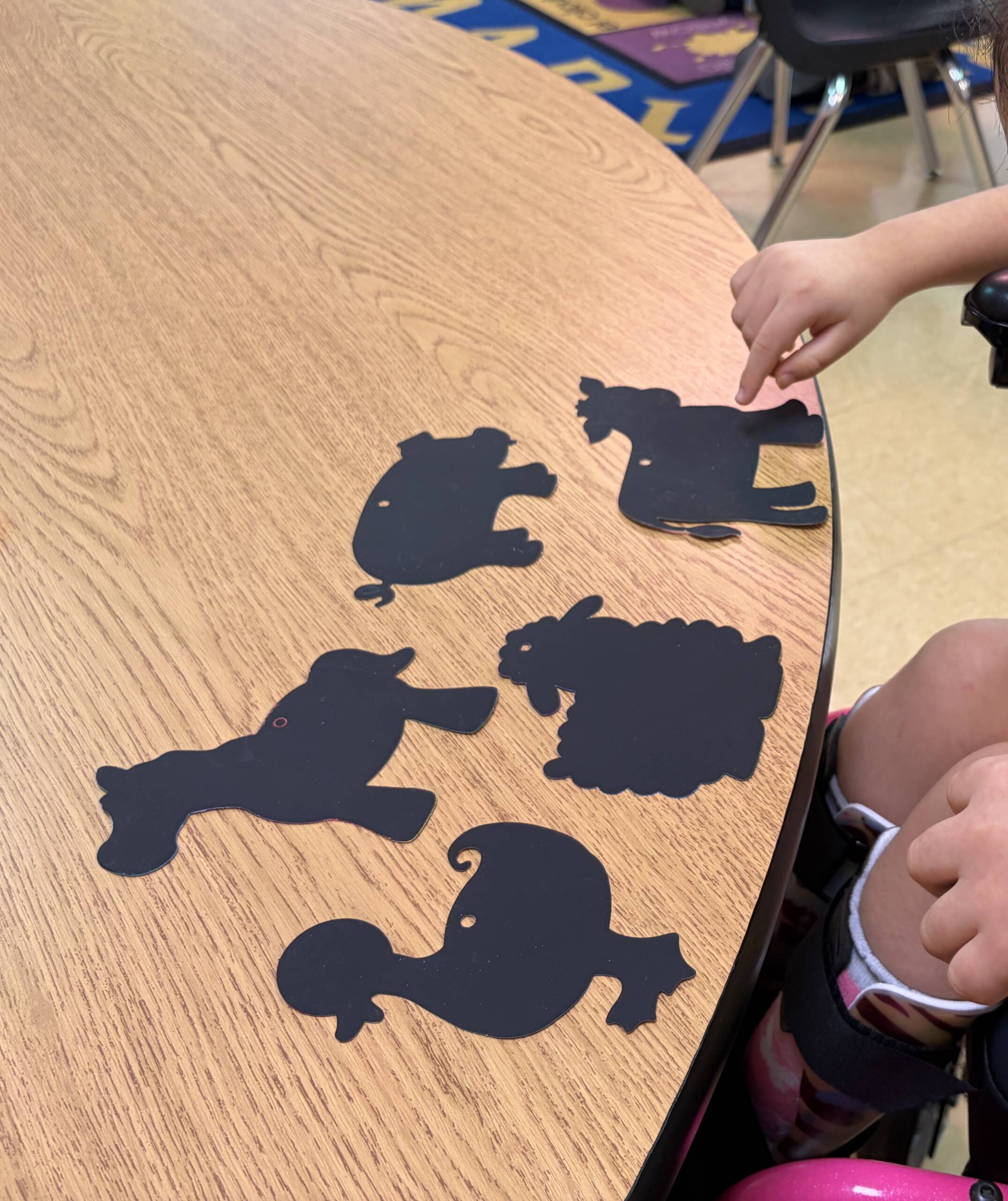 Student choosing an animal for their craft with choices of a horse, cow, pig, duck, and sheep.
